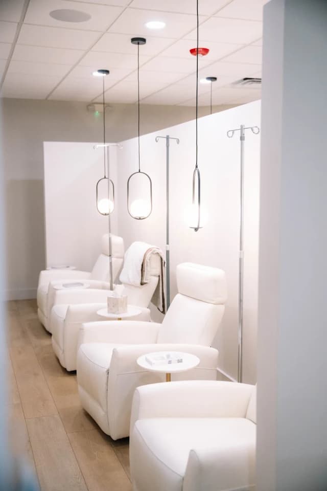 A quiet treatment nook with white recliners