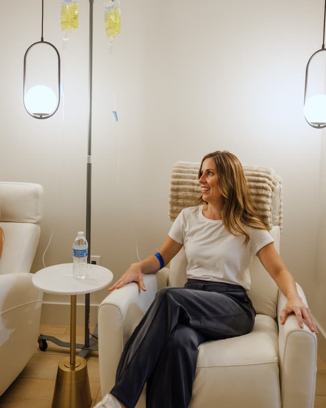 A patient relaxes during a vitamin IV session
