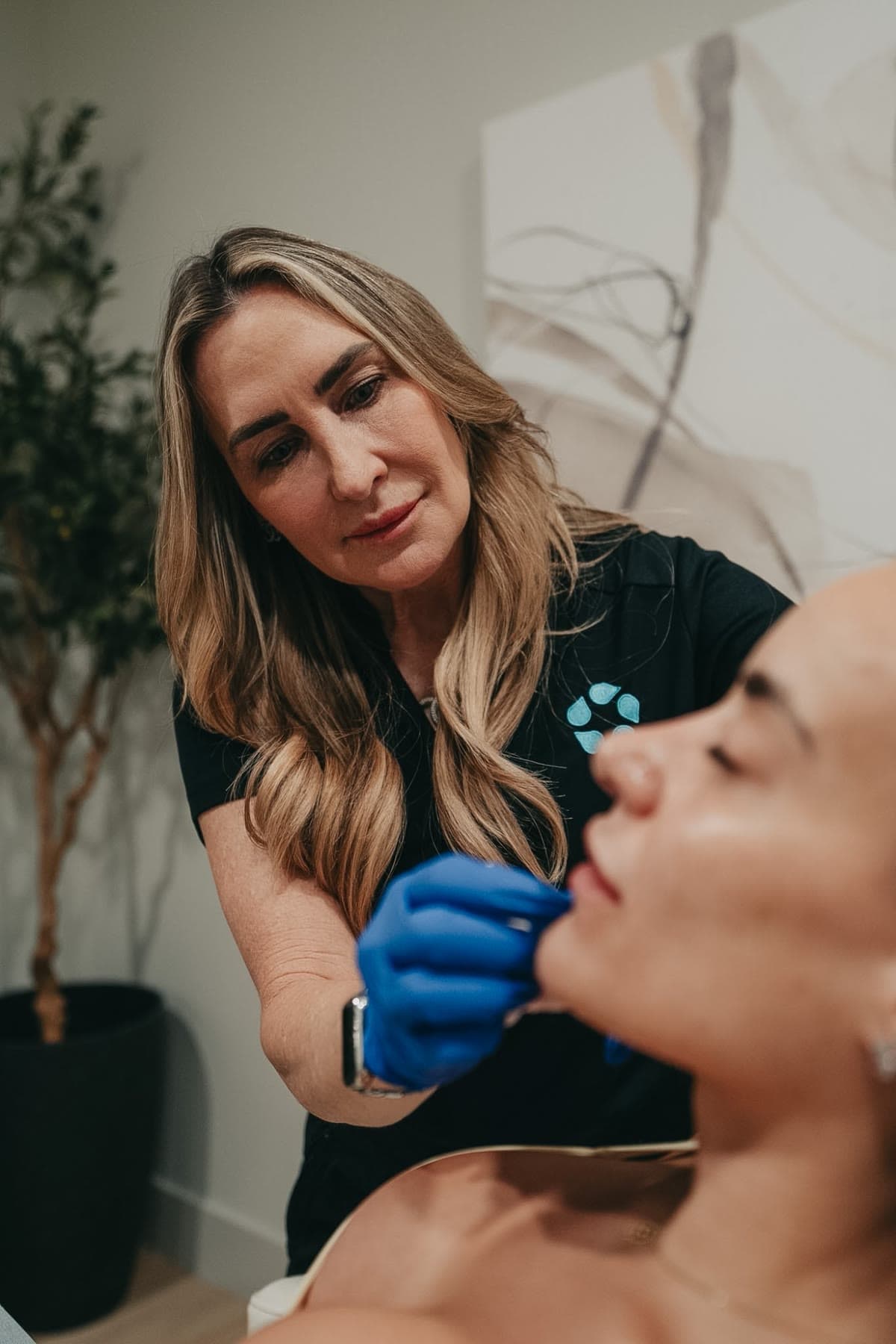 An injector assesses a patient's lips