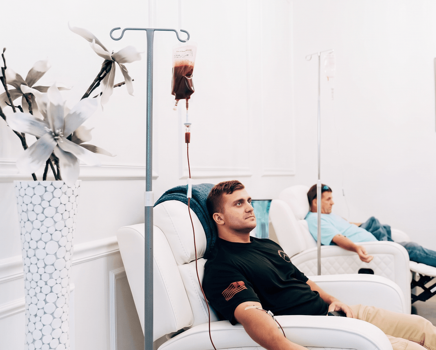 A patient relaxes in a recliner during an ozone therapy session at Relive Health Stuart