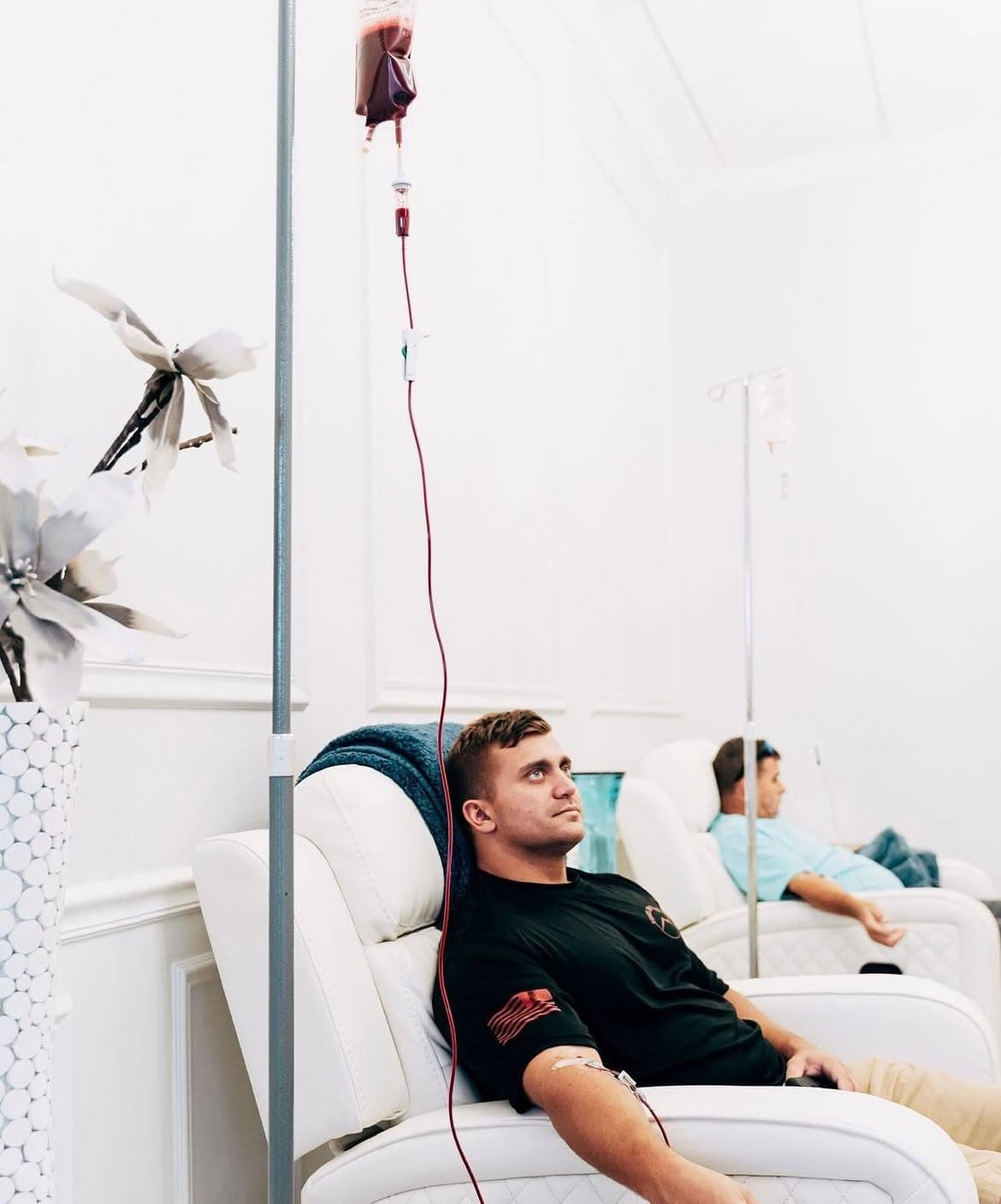 A patient receives ozone therapy in a private recliner at Relive Health Stuart