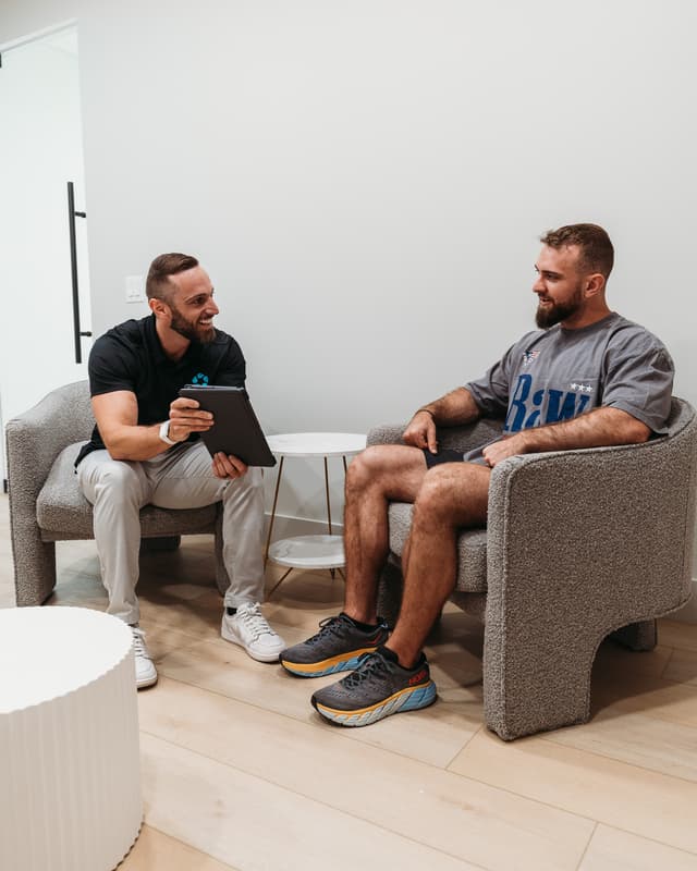 A provider explains peptide therapy to a patient